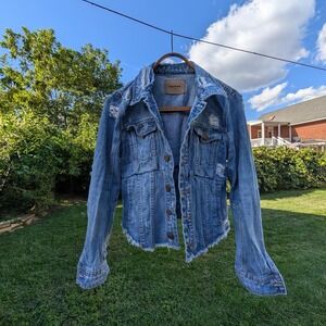 Distressed Blank NYC denim jacket with frayed hem and‎ raw edges